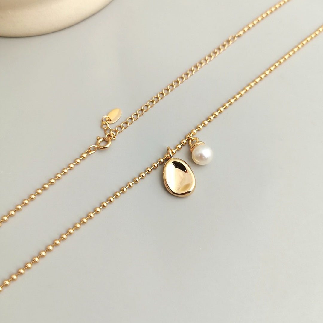 Pearl Necklace with Oval Silver Pendant